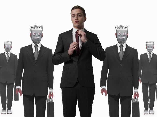 a-worker-in-front-of-robot-workers-640x480-1 A worker in front of robot workers