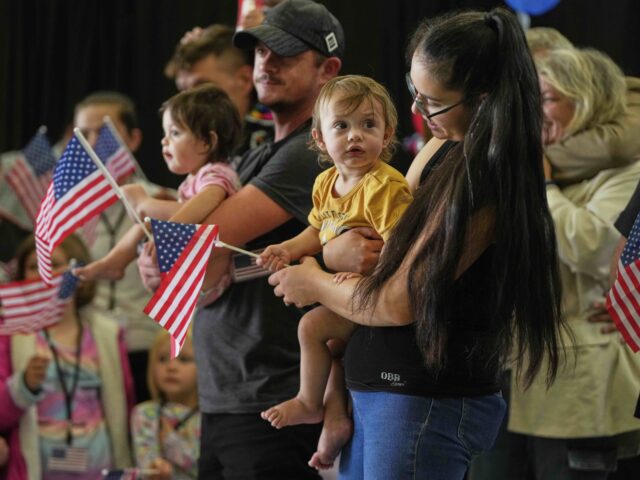 Afrikaner refugees (Julia Demaree Nikhinson / Associated Press) Afrikaner refugees from South Africa holding American flags arrive, Monday, May 12, 2025,