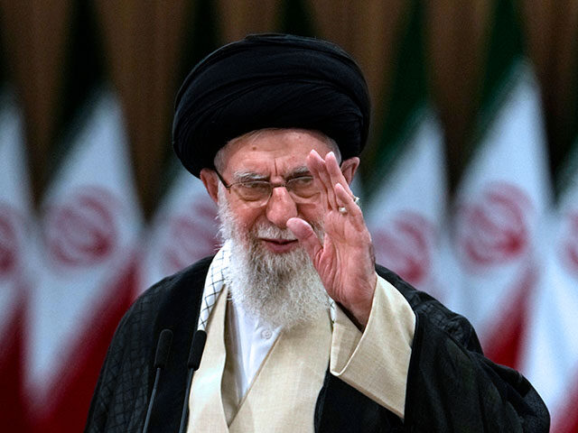 ap24187183376164-640x480-1 Iranian Supreme Leader Ayatollah Ali Khamenei waves after casting his vote for the preside