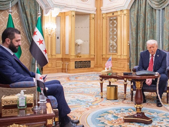 AP25134358762689-2 In this photo released by the Saudi Royal Palace, President Donald Trump, centre, meets wi