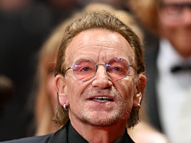 bono strikes CANNES, FRANCE - MAY 16: Irish singer-Songwriter and executive producer Bono arrives for t