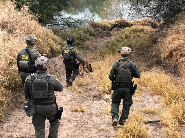 border security working Border Patrol agents search for migrant smugglers who opened fire on their position. (U.S.