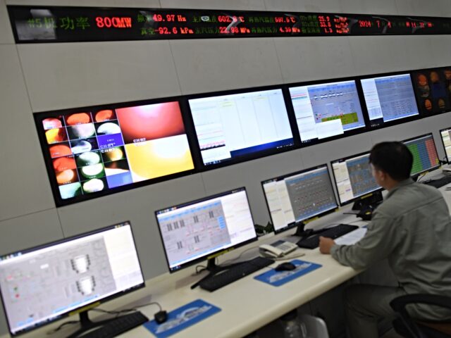 china energy dominance WUHAN, CHINA - JULY 04 2024: A worker monitors operations at a coal-fired power plant in W