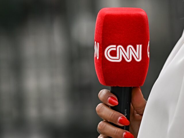 CNN audience drops PARIS, FRANCE - JULY 08: CNN microphone held by a reporter outside the entrance gate to th
