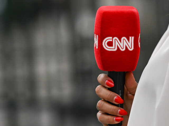 CNN microphone CNN microphone held by a reporter outside the entrance gate to the Palais Bourbon, home to