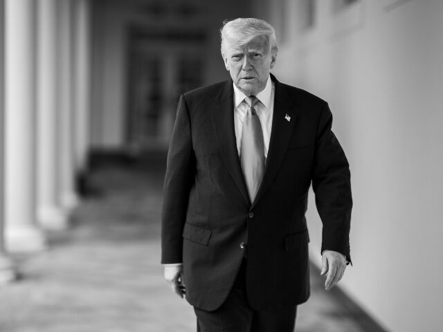 Donald Trump President Donald Trump walks along the West Colonnade on the way to the residence for an e