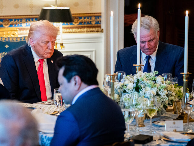 Donald Trump and Franklin Graham President Donald Trump bows his head during a prayer at an Easter prayer service and dinne