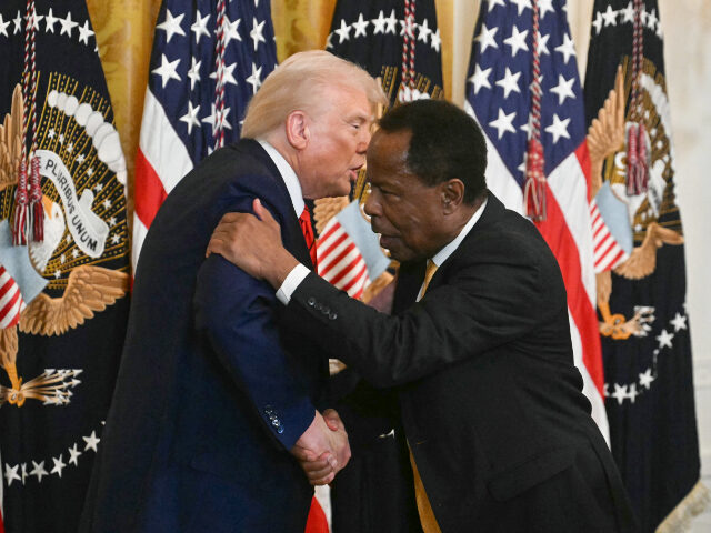 Donald Trump and Leo Terrell US President Donald Trump shakes hands with civil rights attorney and talk radio host Leo