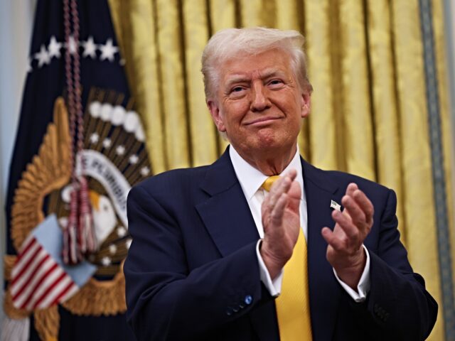 donald trump applauds WASHINGTON, DC - FEBRUARY 21: U.S. President Donald Trump applauds after Howard Lutnick wa