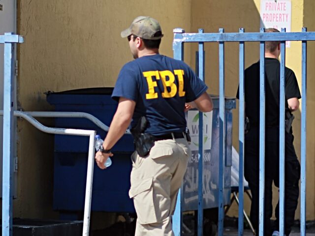 <> on October 21, 2010 in Miami, Florida. MIAMI - OCTOBER 21: An agent with the F.B.I. is seen outside the American Therapeutic Corp