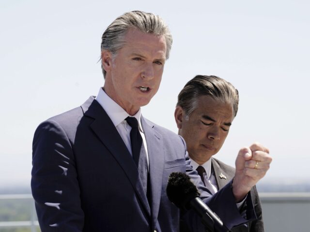 Gavin Newsom (Rich Pedroncelli / Associated Press) Standing atop the Cal. EPA building, Calif. Gov. Gavin Newsom discusses the U.S. Senates v