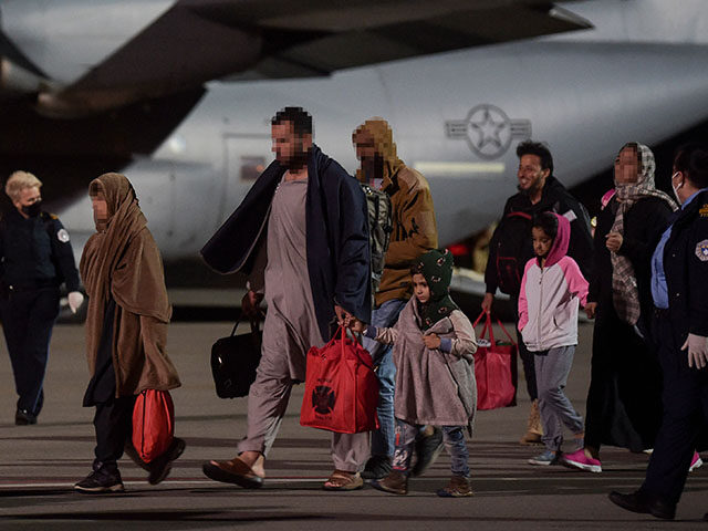 gettyimages-1234946603-640x480-1 Afghan refugees, fleeing the Afghan capital Kabul, exit an US air force plane upon their a