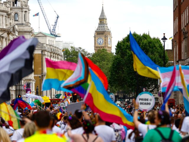 gettyimages-1507518233-1-640x480-1 LONDON, ENGLAND - JULY 01: Revellers carry flags during the Gay Pride Parade on July 01, 2