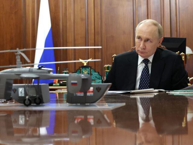gettyimages-2171600829-1-640x480-1 In this pool photograph distributed by Russian state agency Sputnik, Russia's President Vl