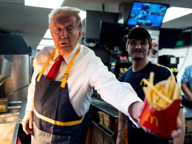 GettyImages-2178845701 Former President Donald Trump as he works behind the counter during a visit to McDonalds i