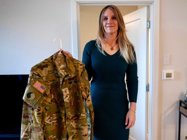 GettyImages-2202399352 Jo Ellis holds one of her firearms in her apartment in Richmond, Virginia, on February 12,