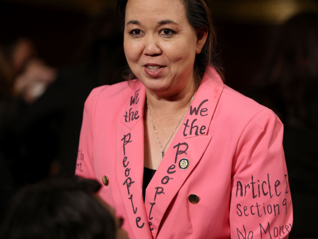 GettyImages-2203332146 WASHINGTON, DC - MARCH 04: Rep. Jill Tokuda (D-HI) wears a jacket with writing of the U.S.