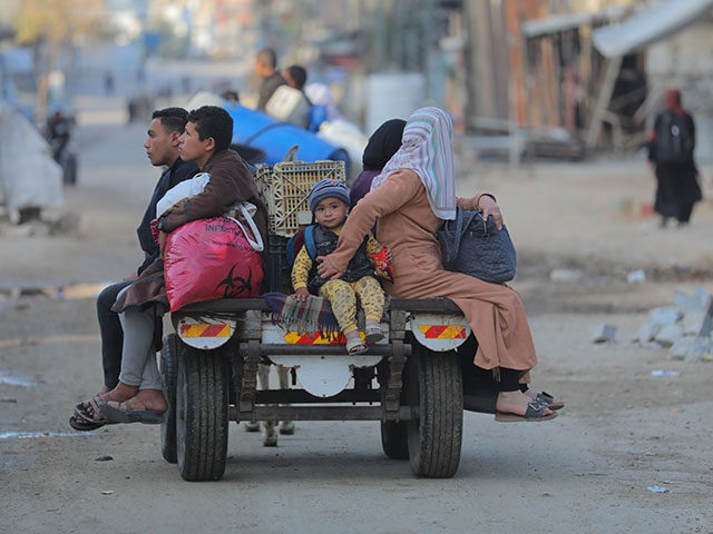 gettyimages-2205143761-640x480-1 Palestinians in the Al-Mughraqa area of Gaza City, Gaza, travel with what belongings they