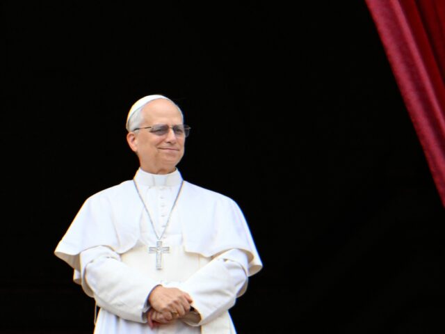 gettyimages-2213930482-1-640x480-1 Pope Leo XIV greets the crowd after the Regina Caeli prayer from the main central loggia b