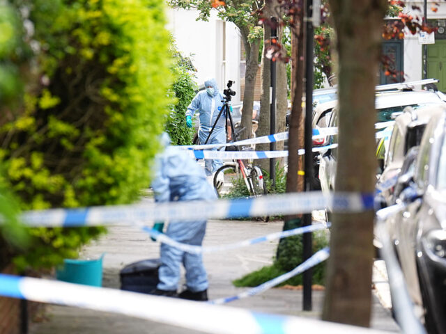 Kentish Town fire A forensics officer is seen in Kentish Town, north London. Police are investigating a fire