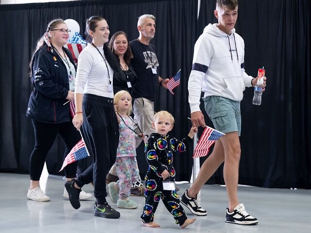 GettyImages-2214155951-2 The first group of Afrikaners from South Africa to arrive for resettlement listen to remar