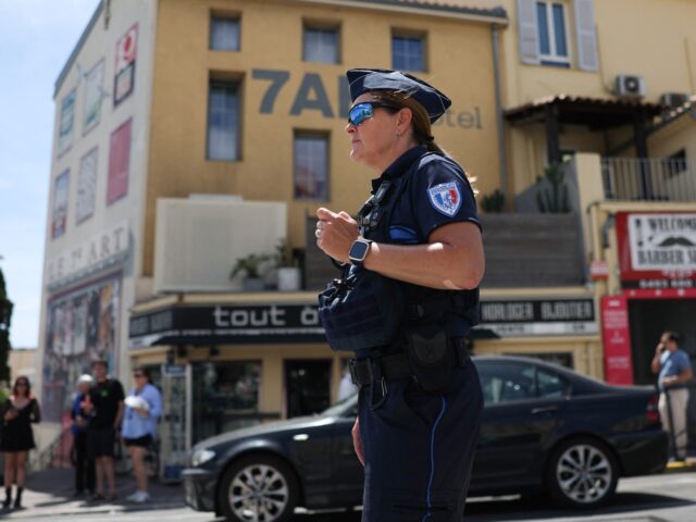 gettyimages-2216053580-1-640x480-1 A municipal police officer directs traffic as traffic lights no longer function after a po