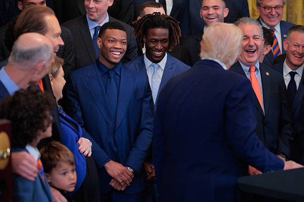 gettyimages-2216341496-612x612-1 President Donald Trump jokes wth Alijah Martin and Denzel Aberdeen while hosting the 2025 NCAA men's basketball champion Florida Gators to celebrate...