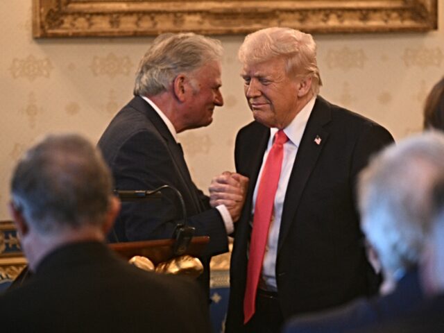 graham and trump Rev. Franklin Graham shakes hands with US President Donald Trump after addressing an Easte