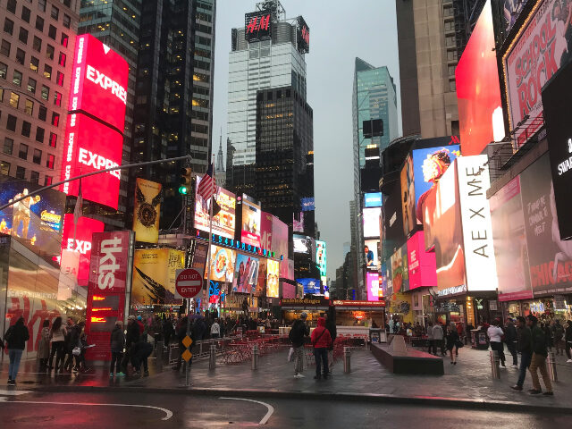 guido-coppa-pFyH0WYub5w-unsplash Times Square group-of-people-walking-near-the-building