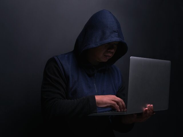 hacker-works-on-laptop-640x480-1 hacker works on laptop