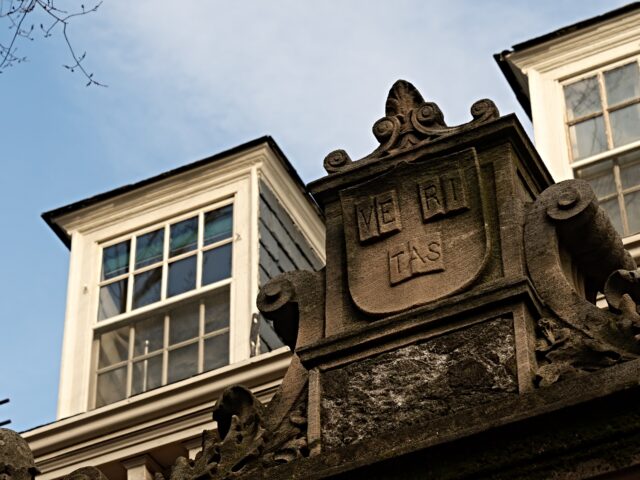 harvard responds The Harvard University seal at an entrance to the campus in Cambridge, Massachusetts, US,