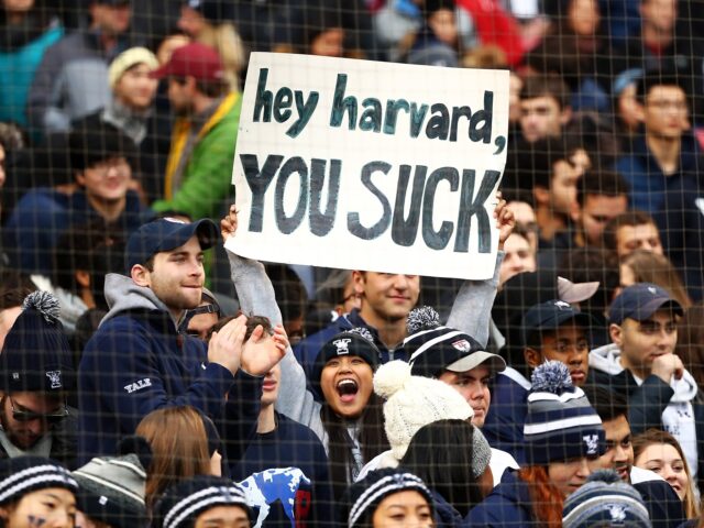 Harvard sucks (Adam Glanzman / Getty) BOSTON, MA - NOVEMBER 17: A Yale Bulldogs fan holds a sign that reads 'Harvard Sucks&