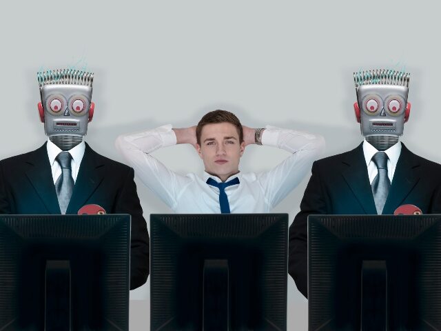 human-flanked-by-ai-powered-worker-robots-640x480-1 Human flanked by AI-powered worker robots