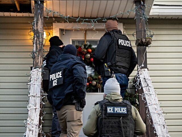 ICE raid US Immigration and Customs Enforcement (ICE) agents knock on the door of a residence durin