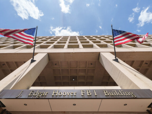J. Edgar Hoover FBI Building A bronze sign identifies the Federal Bureau of Investigation (FBI) headquarters building o