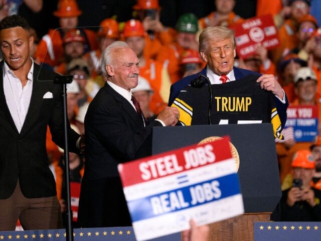 Jeff Swensen_Getty Images WEST MIFFLIN, PENNSYLVANIA - MAY 30: President Donald Trump receives a Pittsburgh Steeler