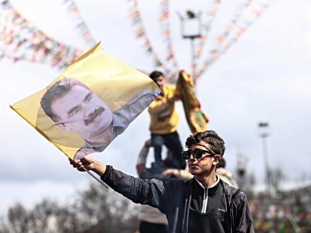 Kurdish PKK DIYARBAKIR, TURKEY - MARCH 21: A Kurdish youth holds a poster of jailed PKK militant group
