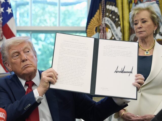 Linda McMahon and Trump (Alex Brandon / Associated Press) FILE - President Donald Trump holds a signed an executive order relating to school discipl