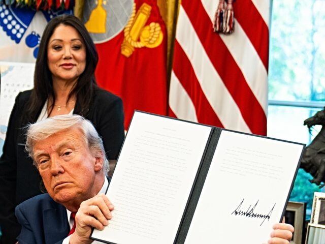 lori chavez-deremer and trump WASHINGTON, DC April 23, 2025: US President Donald Trump signs Executive Order in the Oval