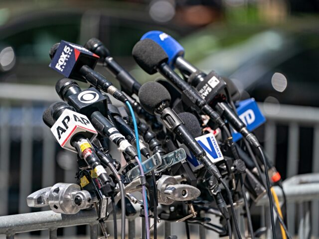 media outlets NEW YORK, NEW YORK - MAY 28: Microphones from various media outlets set up outside of Manh