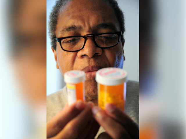 Person Looks at Prescription Drug Bottles Photo by oscar Williams- https-_www.pexels.com_photo_man-holding-pill-bottles-15307047 Person Looks at Prescription Drug Bottles Photo by oscar Williams/Peels