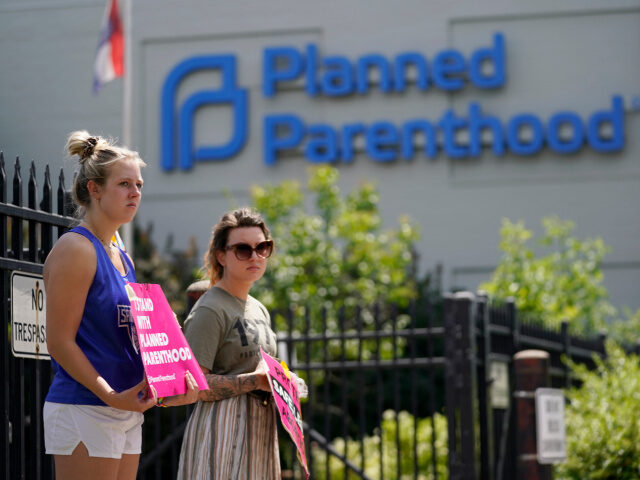 Planned Parenthood and Supporters Kendal Underwood, left, and Brittany Nickens protest in support of abortion rights outside