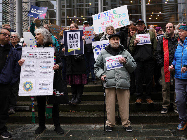 protestors-US-District-Court-federal-judge-refugees-feb25-25-ap FILE - Martin Bernstein, 95, whose parents were refugees, at center, holds a sign as peopl