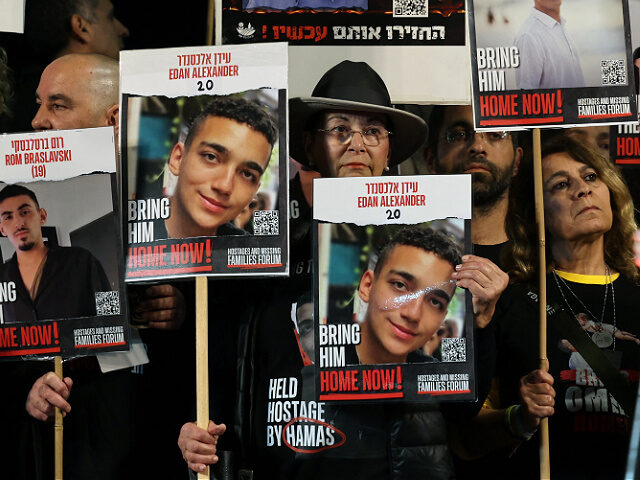 rally-Edan-Alexander-other-hostages-Hamas-file23-getty TOPSHOT - Relatives and supporters hold placards bearing portraits of Israeli hostages hel
