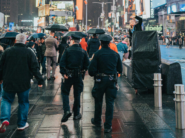 remy-penet-b8WG58rPSDI-unsplash group-of-police-officers-walking-down-a-street
