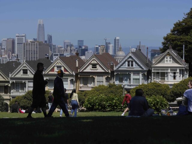 San Francisco Painted Ladies (Jeff Chiu / Associated Press) People walk along at path in front of the "Painted Ladies," a row of historical