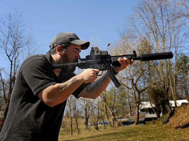 short barrel rifle There's burst of smoke and ejecting shell as A.J. Wynne shoots a Heckler & Koch M