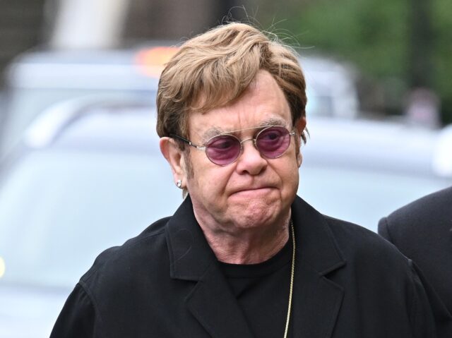 sir elton john LONDON, ENGLAND - FEBRUARY 2: Elton John and David Furnish attend the funeral of Derek Dra