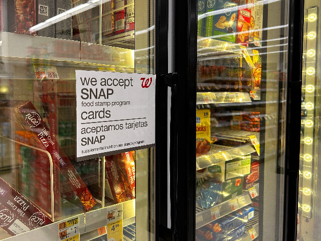 SNAP Bilingual sign on door of frozen food aisle, We accept SNAP food stamp cards, Walgreens, Q