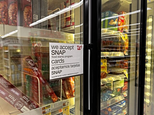 food stamps Bilingual sign on door of frozen food aisle, We accept SNAP food stamp cards, Walgreens, Q